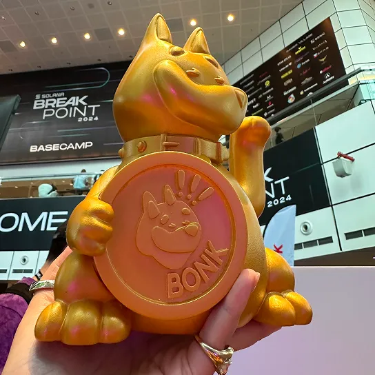 A gold cat collectible with an NFC chip inside